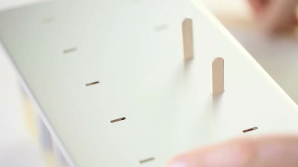 Making homemade fresh fruit popsicles with apple juice. alt