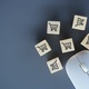 Computer mouse and wooden cubes with shopping trolley icon.  - PhotoDune Item for Sale