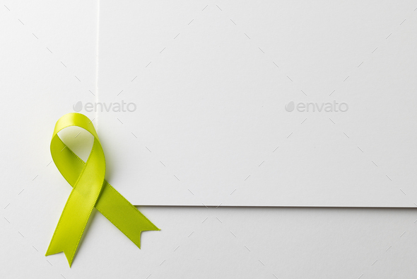 Vertical composition of light green std health awareness ribbon and ...