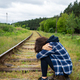 Stress, sadness, loneliness, pain. An upset girl sits on the rails, a psychological situation - PhotoDune Item for Sale