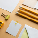 Flat lay of yellow pencils, sharpener and white paper with copy space on yellow background - PhotoDune Item for Sale