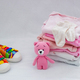 Children&#39;s things on a light background. The concept of baby clothes - PhotoDune Item for Sale