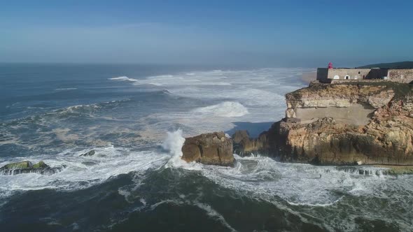 Lighthouse on Cliff on Atlantic Ocean in Nazare alt
