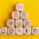 Graduation hat symbols in wooden cubes stacked, Internet education course degree, - PhotoDune Item for Sale