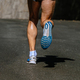 sole running shoe male runner, background dark road, summer marathon race - PhotoDune Item for Sale