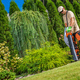 Professional Gardener with Electric Garden Vacuum - PhotoDune Item for Sale