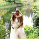Hapy pregnant couple hugging at the lake - PhotoDune Item for Sale