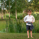 Portrait of a Latvian boy in the midsummer evening - PhotoDune Item for Sale
