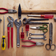 Different work and repair tools on wooden background - PhotoDune Item for Sale
