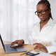 Young black woman working at office, using laptop, copy space - PhotoDune Item for Sale