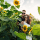 Beautiful couple in sunglases having fun in sunflowers field. A man and a woman in love walk in  - PhotoDune Item for Sale