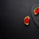 Red caviar on slices of white wheat bread on a black table, concept of luxury and gourmet cuisine - PhotoDune Item for Sale