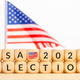 USA 2024 presidential election concept. Wooden block with text and american flag - PhotoDune Item for Sale