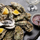 Fresh oysters with glasses of sparkling wine - PhotoDune Item for Sale