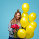 Cheerful plus size woman with flowers and balloons - PhotoDune Item for Sale