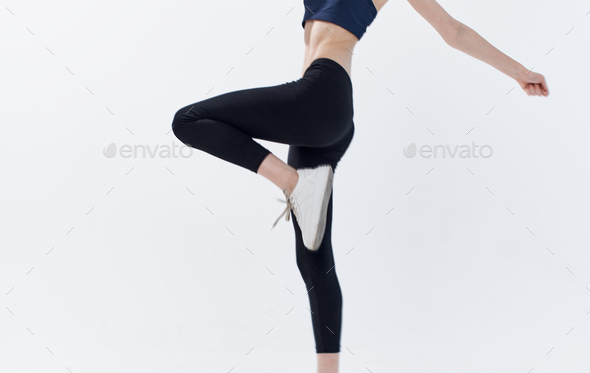 Mockup of white leggings on a slender girl, in the studio on an isolated  clean background, skinny women's pants for presentation of design, side view  Stock Photo - Alamy