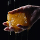 Woman hand with honeycombs full of honey. Dripping, pouring tasty sweet fluid - PhotoDune Item for Sale