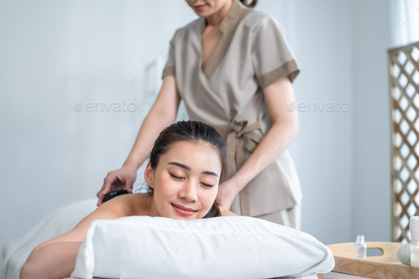 Young Beautiful Woman Getting Back Massage Stock Photo, Picture