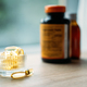 Vitamin D and Bone Health. Vitamin D yellow Soft capsules in glass bottle on table at home. Ways To - PhotoDune Item for Sale