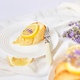 Piece of lemon cake on white table with lavender - PhotoDune Item for Sale