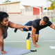 African curvy woman and personal trainer doing functional workout training session outdoor  - PhotoDune Item for Sale
