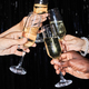 Hands holding champagne glasses against glittering background and toasting - PhotoDune Item for Sale
