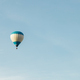 Hot air balloon with tourists against a blue sky. Space for text - PhotoDune Item for Sale
