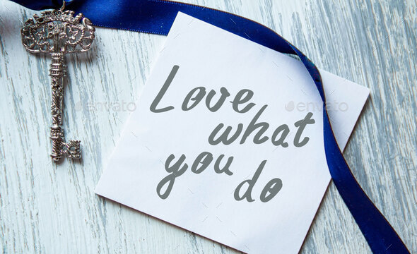 do what you love, love what you do - motivational word abstract vintage keys and a blue ribbon