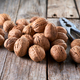 Walnuts on rustic wooden table - PhotoDune Item for Sale
