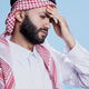Arab man with headache holding forehead - PhotoDune Item for Sale