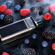 Vape smoking tool on black smoky background with berries - PhotoDune Item for Sale
