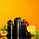 Vape smoking liquid with fruit flavor on orange background - PhotoDune Item for Sale