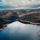 Forest in Autumn with trees near a lake in the mountains aerial view - PhotoDune Item for Sale