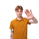 young man with red hair in orange t-shirt shows stop gesture - PhotoDune Item for Sale