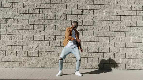 Endless Loop of Cheerful African American Dancer Moving Arms Smiling Dancing Outside alt