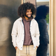 Portrait of a young Afro with hands in pockets - PhotoDune Item for Sale