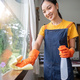 Young Asian housewife clean window glass with rag and detergent spray, cleaning house on the - PhotoDune Item for Sale