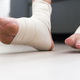 man using put on elastic bandage with legs having leg pain - PhotoDune Item for Sale