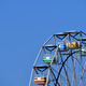 A colorful ferris wheel against a blue sky - PhotoDune Item for Sale