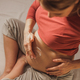 Unrecognizable Pregnant Woman Applying Moisturizing Cream On Her Belly - PhotoDune Item for Sale