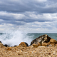 Wave splash at rocky shore and scenic clouds. Banner view - PhotoDune Item for Sale