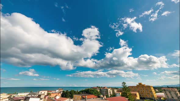 Clouds timelapse on a blue sky alt