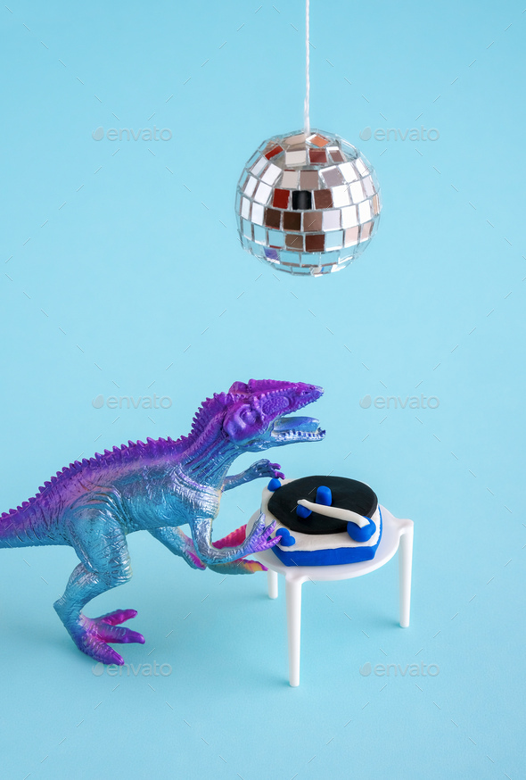 Cute blue and violet dinosaur toy holding listen vinyl on vinyl record player on blue background.