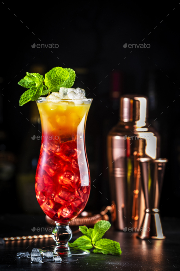Aruba Ariba summer cocktail drink with vodka, rum, orange, lemon and pineapple juice, grenadine