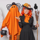Halloween celebration. Studio shot of young disappointed European woman wearing costume of witch - PhotoDune Item for Sale