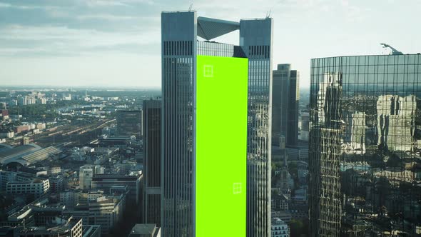 Fly Around Modern Downtown Skyscrapers with Glossy Grass Facades alt