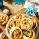 Pizza rolls puff pastry stuffed with prosciutto bacon, mushrooms and cheese on the Christmas table.  - PhotoDune Item for Sale