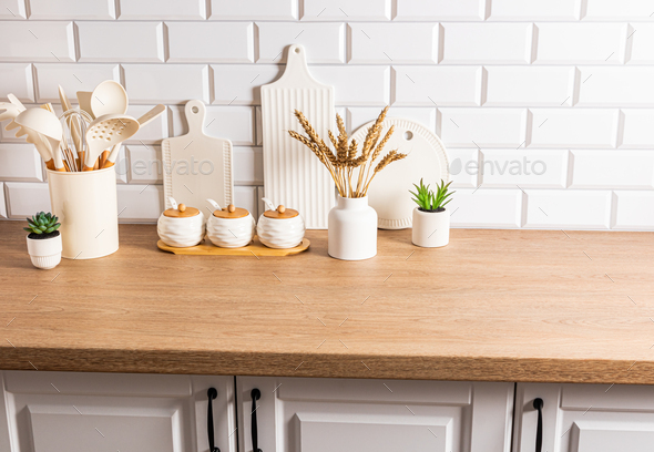Front view of kitchen wooden countertop with a set of various kitchen
