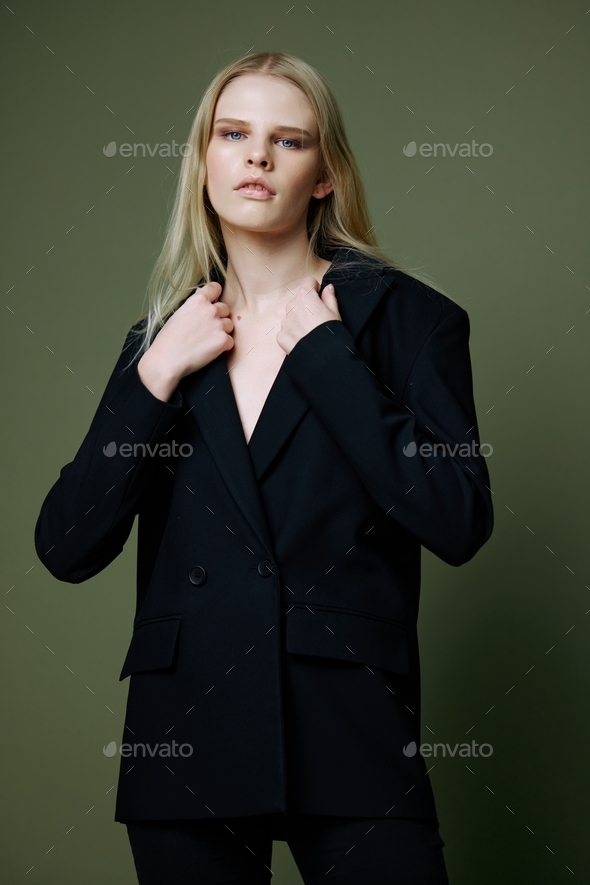Young beautiful woman posing in light-dark office suit. Light blouse and  dark pencil skirt. Formal wear. Stock Photo | Adobe Stock