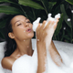 Bath and Body Care Treatment of Spa Woman in Bathtub, Tropical Bathroom Interior - PhotoDune Item for Sale